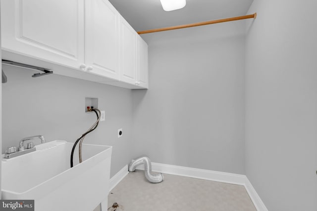 laundry room with sink, washer hookup, hookup for an electric dryer, and cabinets