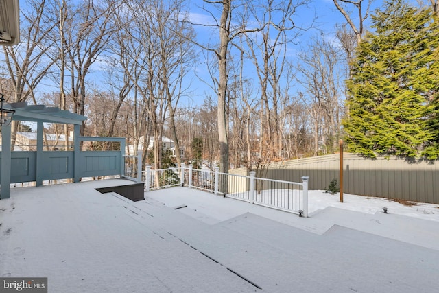 view of yard layered in snow