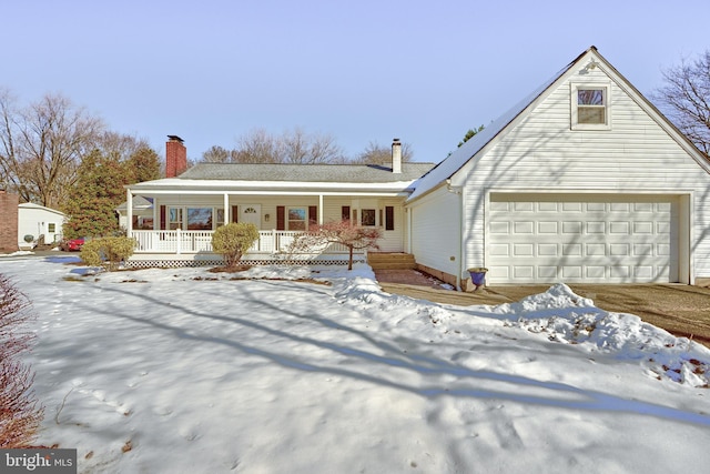 view of front of house with a porch and a garage