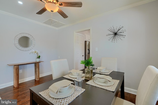 dining area with ceiling fan, crown molding, and dark hardwood / wood-style flooring