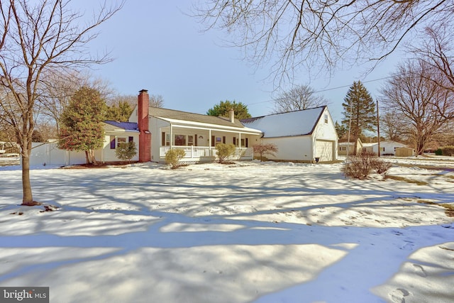 view of front of home with covered porch and a garage