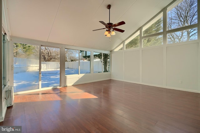 unfurnished sunroom featuring ceiling fan, a wealth of natural light, and lofted ceiling