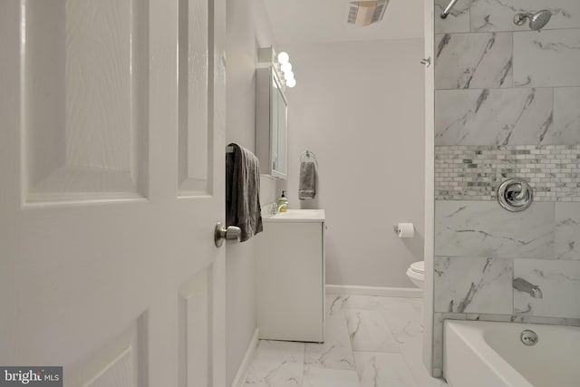 full bathroom featuring toilet, vanity, and tiled shower / bath