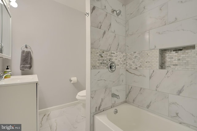 full bathroom with toilet, tiled shower / bath combo, and vanity