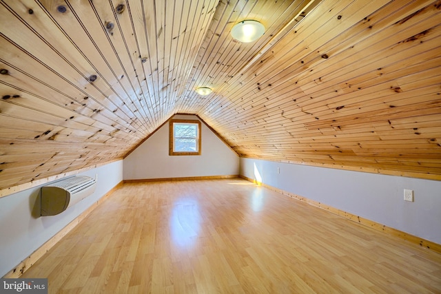 additional living space with light wood-type flooring, vaulted ceiling, and wood ceiling