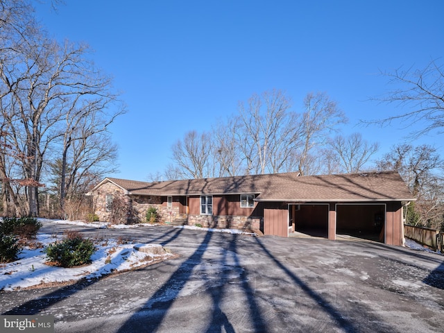 single story home with a garage