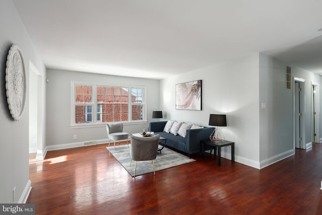 living room featuring dark hardwood / wood-style flooring