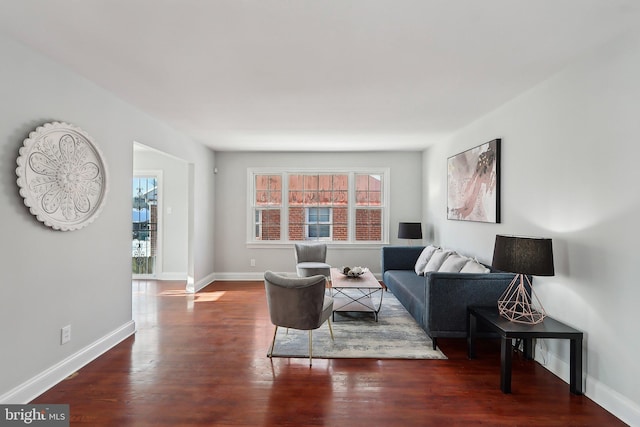 living room with dark hardwood / wood-style flooring