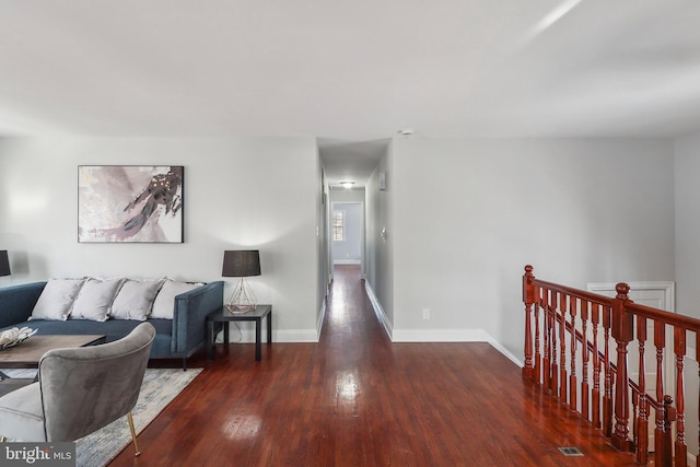 living room featuring dark wood-type flooring