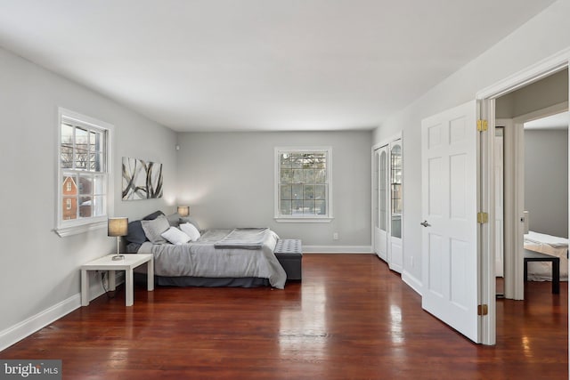 bedroom featuring dark wood-type flooring