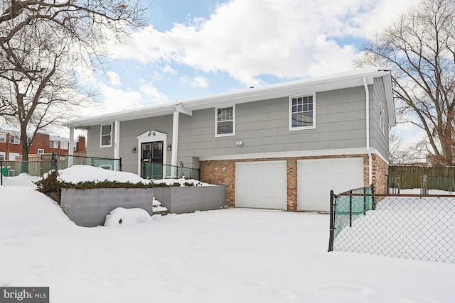 raised ranch featuring a garage