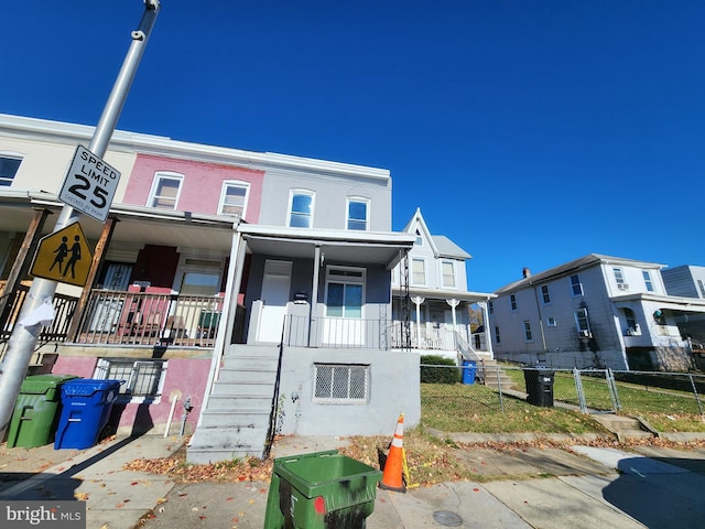 townhome / multi-family property with covered porch