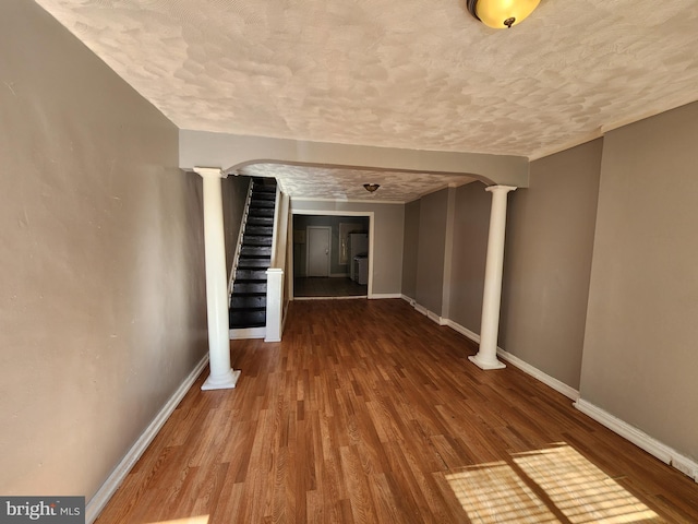 hallway with hardwood / wood-style flooring and a textured ceiling