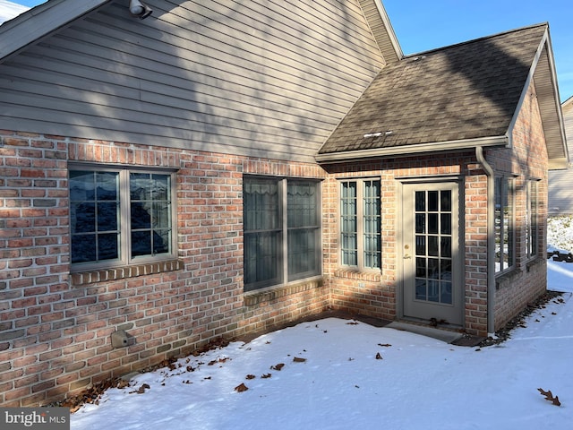 view of snow covered property