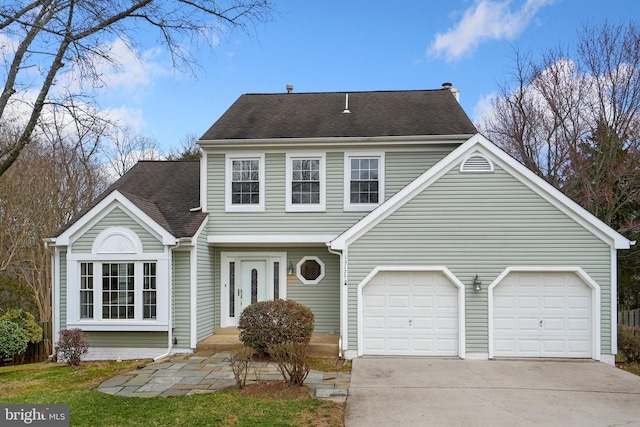 view of front of property with a garage