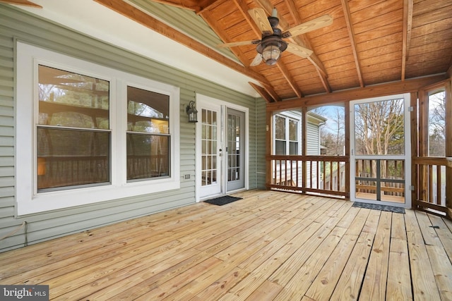 unfurnished sunroom with vaulted ceiling with beams, ceiling fan, and wooden ceiling