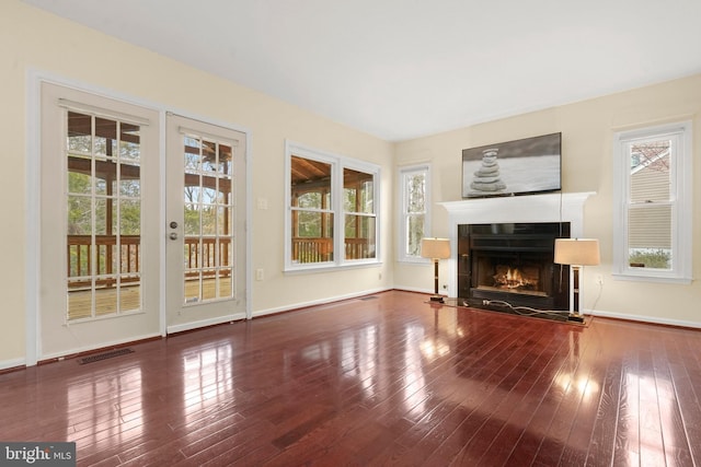 unfurnished living room with wood-type flooring