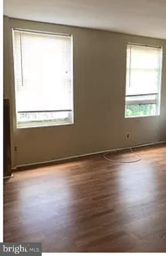 empty room featuring dark hardwood / wood-style floors