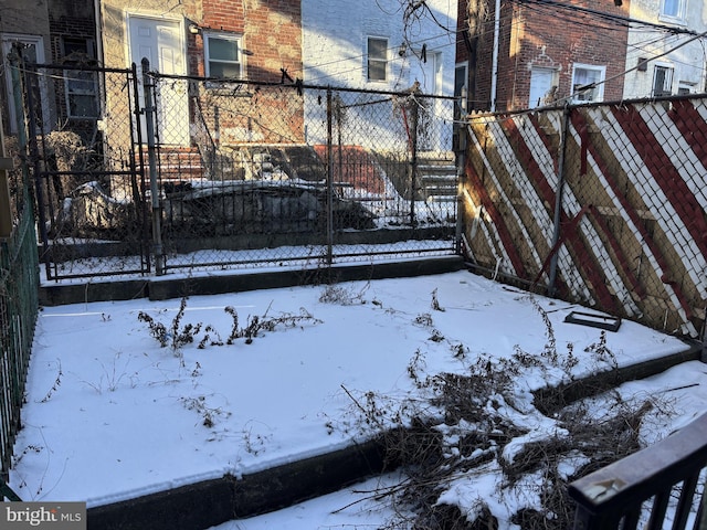 view of snow covered gate