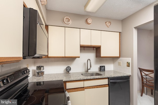 kitchen featuring sink, light stone countertops, black appliances, a textured ceiling, and white cabinets