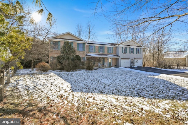 view of front of property with a porch and a garage