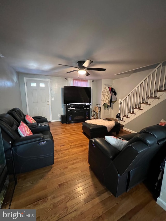 living room with ceiling fan and wood-type flooring