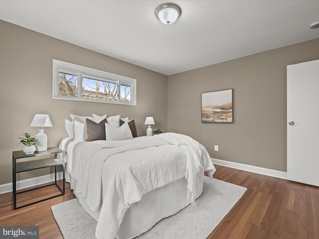 bedroom featuring dark wood-type flooring