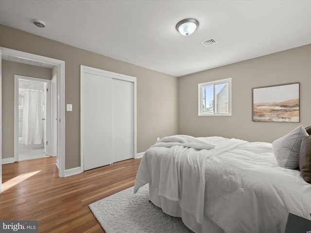 bedroom with hardwood / wood-style flooring