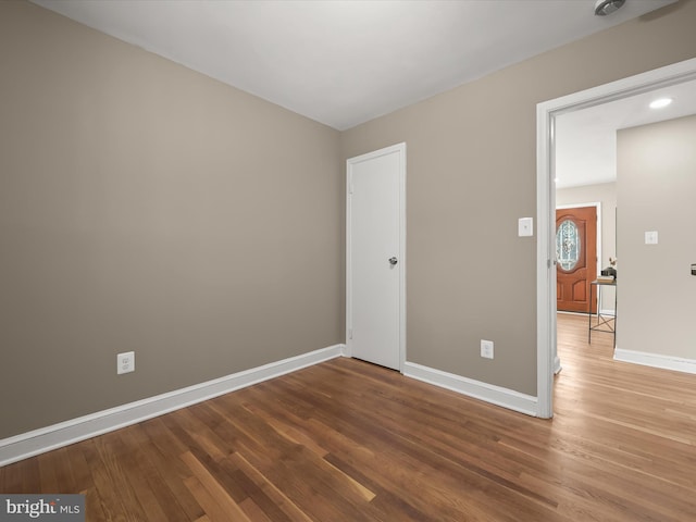 unfurnished room featuring wood-type flooring