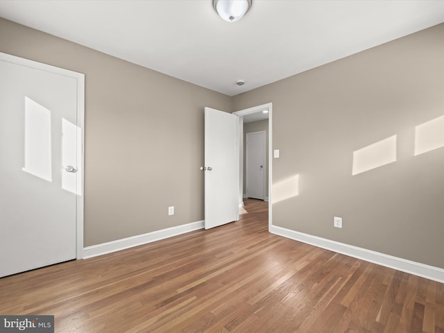 spare room featuring hardwood / wood-style flooring