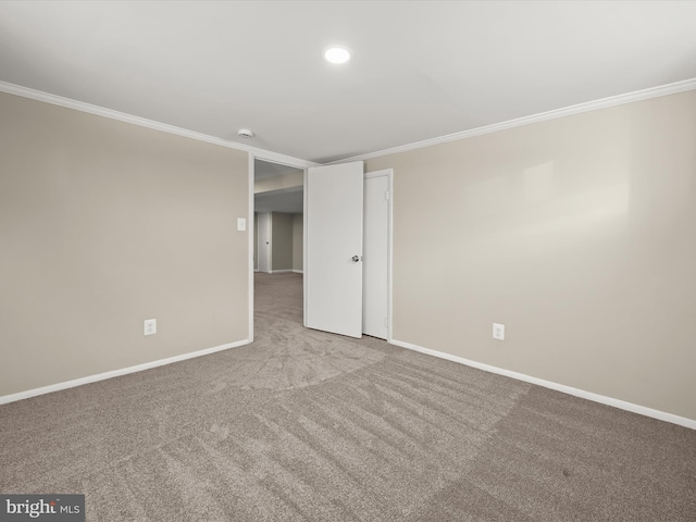 carpeted empty room with ornamental molding