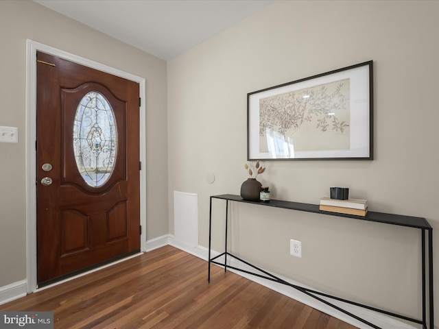 foyer with dark hardwood / wood-style floors