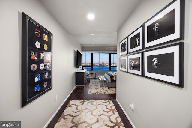 hall with dark hardwood / wood-style floors