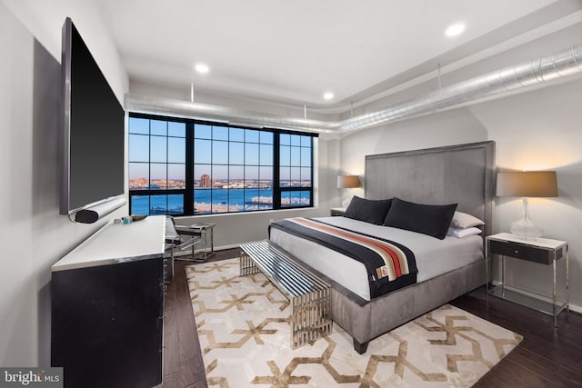 bedroom featuring dark wood-type flooring