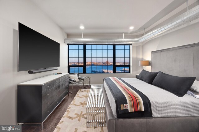 bedroom featuring dark hardwood / wood-style flooring