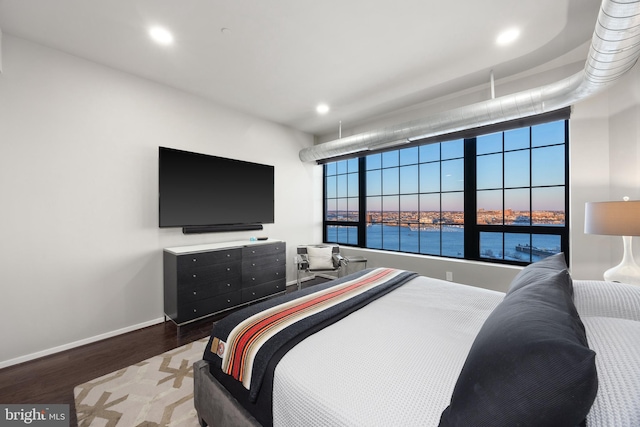 bedroom with hardwood / wood-style floors