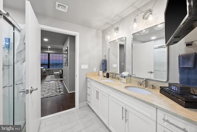 bathroom with tile patterned flooring and vanity