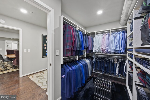 walk in closet featuring dark hardwood / wood-style flooring