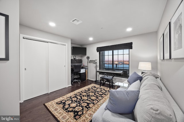 living room with dark hardwood / wood-style flooring