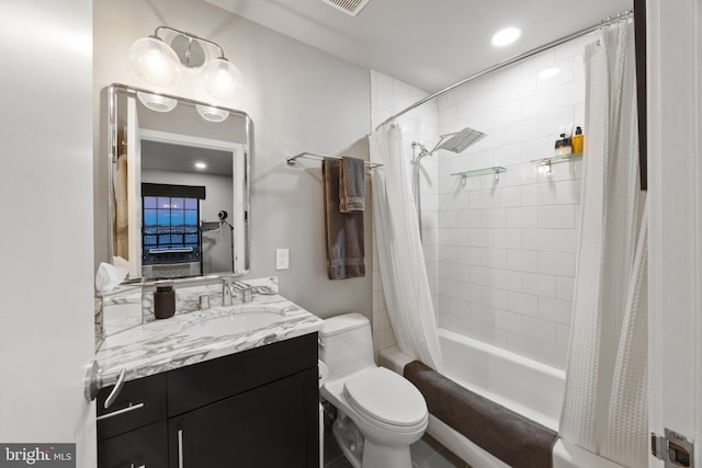 full bathroom featuring vanity, toilet, and shower / bathtub combination with curtain