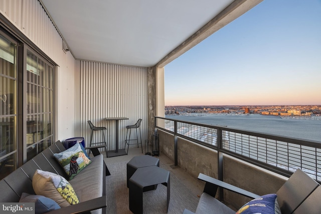 balcony at dusk with a water view