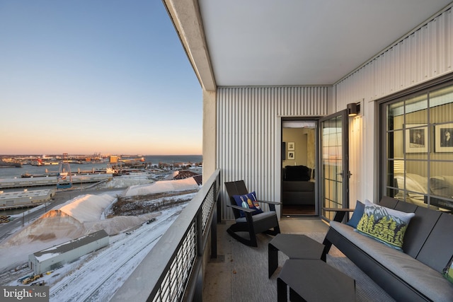 balcony at dusk featuring outdoor lounge area