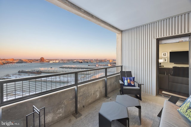 balcony at dusk with a water view