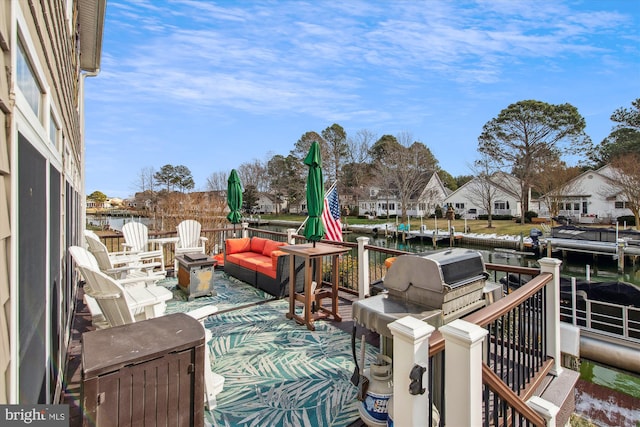 exterior space with an outdoor living space and a water view