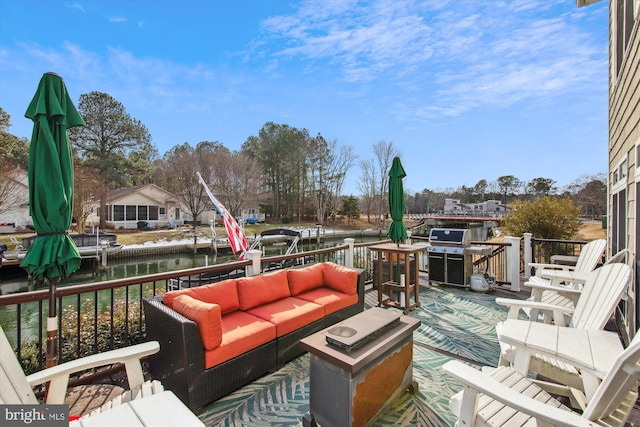 deck featuring a water view and outdoor lounge area