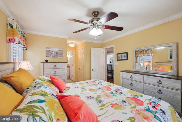 bedroom with a closet, ceiling fan, connected bathroom, and ornamental molding