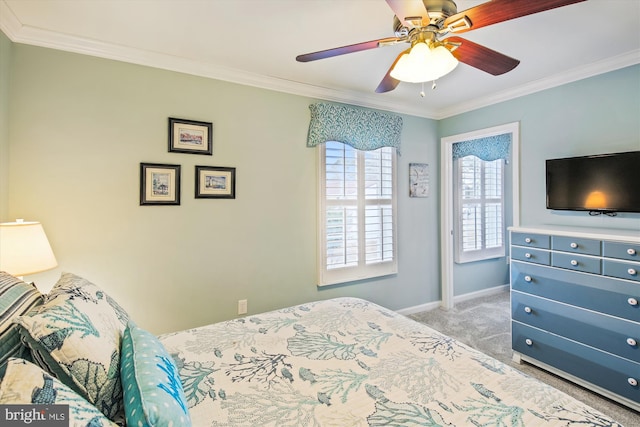 bedroom with carpet flooring, ceiling fan, and ornamental molding