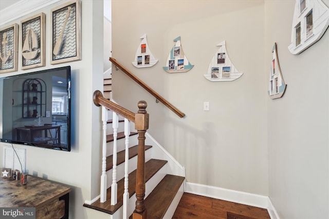 stairs featuring hardwood / wood-style floors