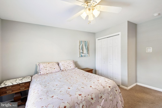 carpeted bedroom with a closet and ceiling fan