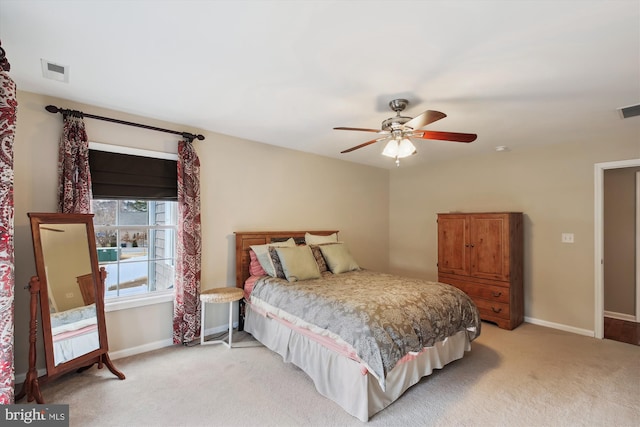 bedroom featuring ceiling fan and light colored carpet